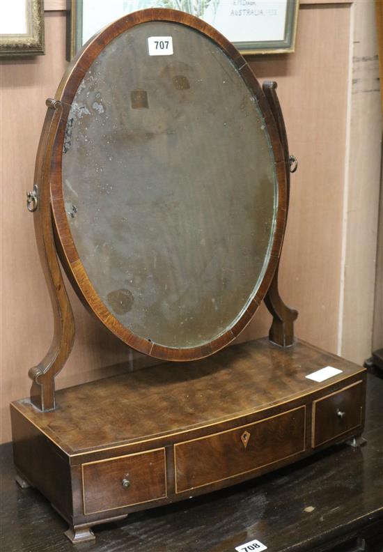 A bowfront toilet mirror, W.45cm